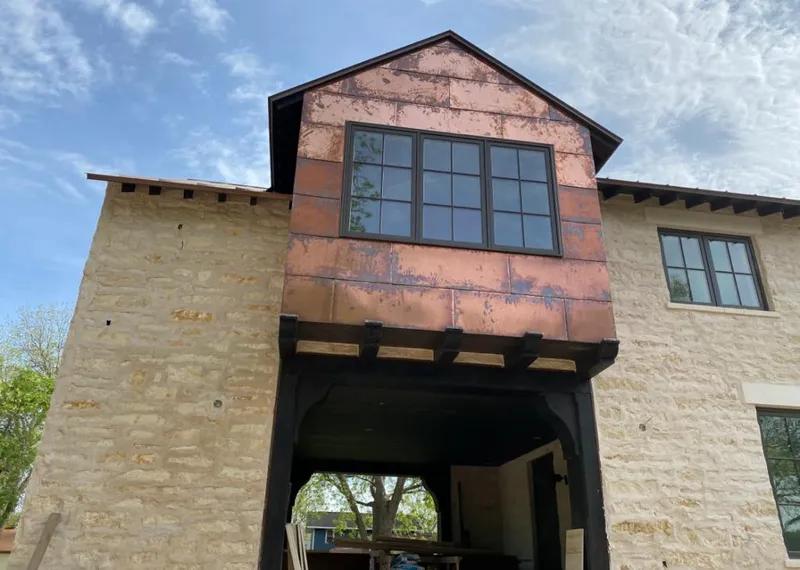 Copper metal panel facade on a stone building for Metal Roof Coating in Tulare